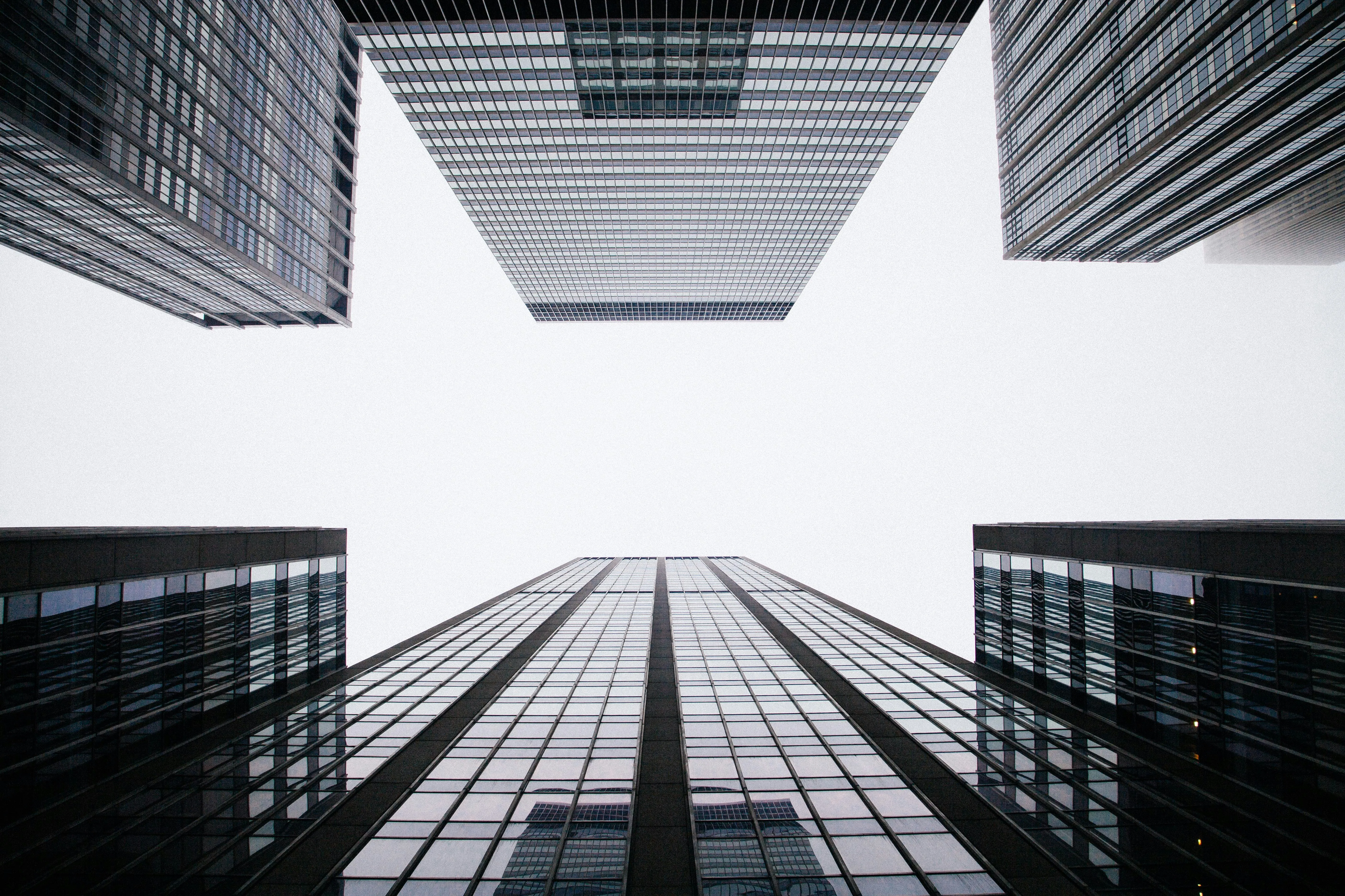 worm's eye view of buildings by Anthony DELANOIX courtesy of Unsplash.
